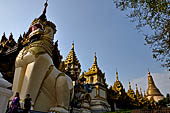 Yangon Myanmar. Shwedagon Pagoda (the Golden Stupa). The southern entrance guarded by two colossal chinthe (half lion, half-dragon guardian figures). 